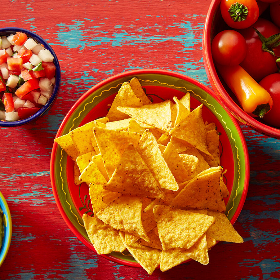 Nachos with guacamole pico de gallo sauce and chii peppers